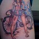 girl-on-bike-tattoo